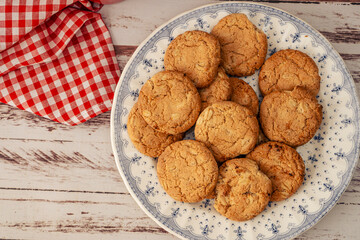 Aerial view of a classic country plate with oatmeal cookies with raisins and seeds Concept of natural nutrition.