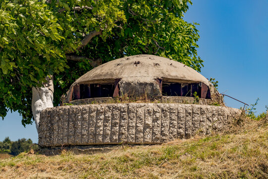 Closeup of one of the countless military concrete bunkers or pillboxes in southern Albania built by communist government of Enver Hoxha. Bunker is turned to the west.