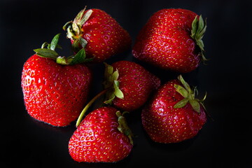 Ripe strawberries on a solid background, healthy vegetarian food. Beautiful