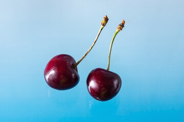 Ripe cherries on a solid background, healthy vegetarian food. Beautiful
