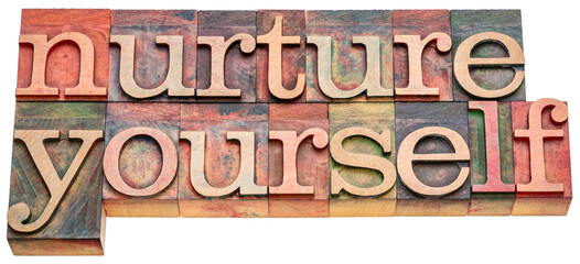 nurture yourself - inspirational word abstract in vintage letterpress wood type, self-care concept