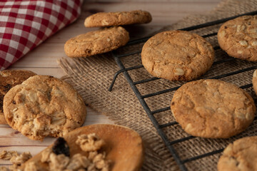 Chopped view and close up of oatmeal raisin cookies on a wire rack. Natural nutrition concept.