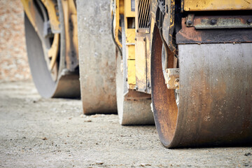 Heavy construction machines outdoors for public place reconstruction.