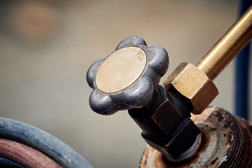 Detail of a hydraulic valve and hoses from a heavy construction machine.
