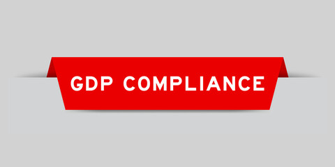 Red color inserted label with word GDP (Abbreviation good distribution practice) compliance on gray background