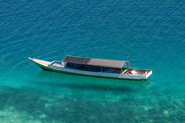 Fototapeta premium boat on the beach of the 17-island, Riung Indonesia