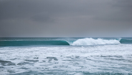 Stormy ocean view with big waves breaking on the Atlantic Ocean in Spain. Winter Atlantic storm with big breaking waves