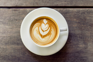 Latte art coffee in a white mug