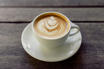 Latte art coffee in a white mug