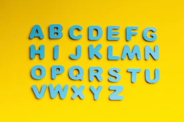 Blue letters on a yellow background
