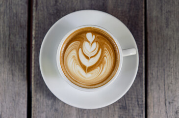 Latte art coffee in a white mug