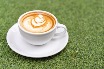 Latte art coffee in a white mug