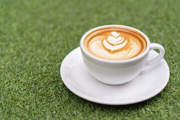Latte art coffee in a white mug