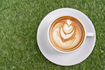 Latte art coffee in a white mug
