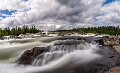 view of the Trappstegsforsarna waterfall in northern Sweden