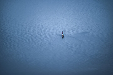Fototapeta na wymiar man fishing on canoe