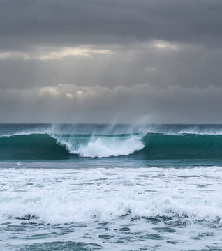 Stormy ocean view with big waves breaking on the Atlantic Ocean in Spain. Winter Atlantic storm with big breaking waves
