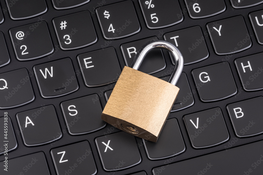 Poster computer security concept. padlock on black laptop keyboard