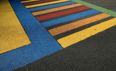 Colorful zebra crossing in rainbow colors.