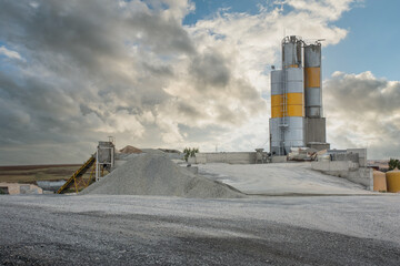 Quarry aggregate with heavy duty machinery.