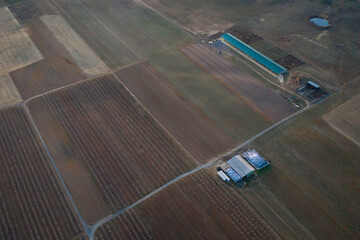Top view shot of farmland with cultivated agricultural fields