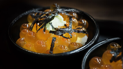Ikura roe. Salmon Ikura Roe Served with rice and top with japanese Seaweed. Ikura don very famous menu in Hokkaido Japan. Most Served in hotel buffet breakfast. salmon roe or red caviar. Japanese food