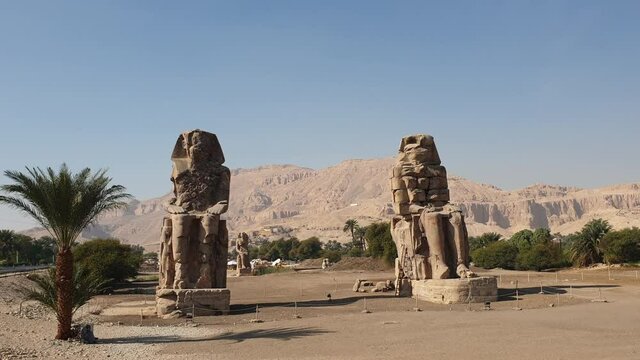 Colossi of Memnon whistle pharoah statues in Luxor Egypt