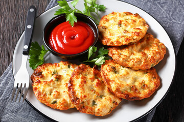 Cheesy Chicken Fritters on a plate, top view
