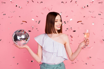 Photo of young girl happy positive smile party drink champagne disco ball isolated over pastel...
