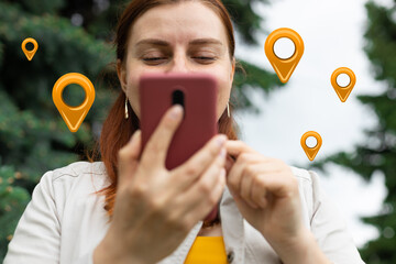 Traveler woman hands use map on mobile phone app to search for route location of place with gps on...