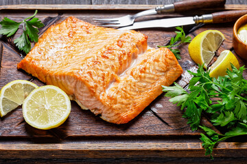 grilled salmon fillet on a wooden cutting board