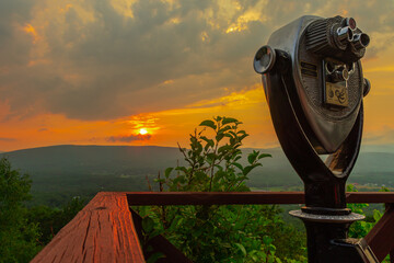 The view from the hairpin turn on the Mohawk Trail in North Adams MA.  during a sunset after storms