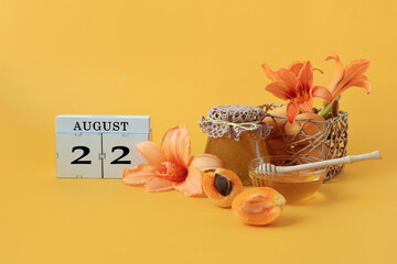 Calendar for August 22 : the name of the month of August in English, cubes with the number 22,...