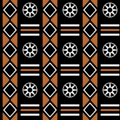 Seamless geometric African tribal pattern with rhombus, triangles and wheel shapes in brown and white colors on black background