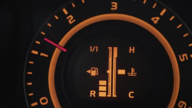 Car speedometer (odometer) panel on dashboard, revving engine