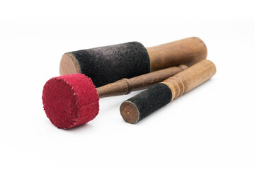 A set of wooden stacks for a Tibetan Singing Bowl. Isolated on a White background