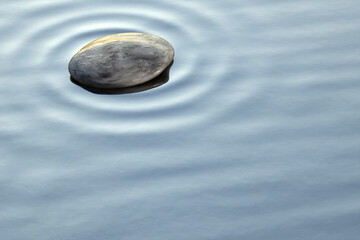 pebbles in the clear ocean water background