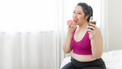 Portrait beautiful  young Asian plump woman joy of eating Junk food , unhealthy food , Sweet treat...
