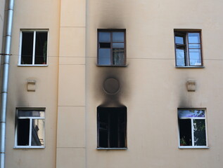 Burnt windows of a residential building after a fire, Malookhtinsky Prospekt, St. Petersburg,...