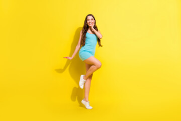 Fototapeta na wymiar Full length body size view of attractive amazed cheerful girl dancing having fun posing isolated over bright yellow color background