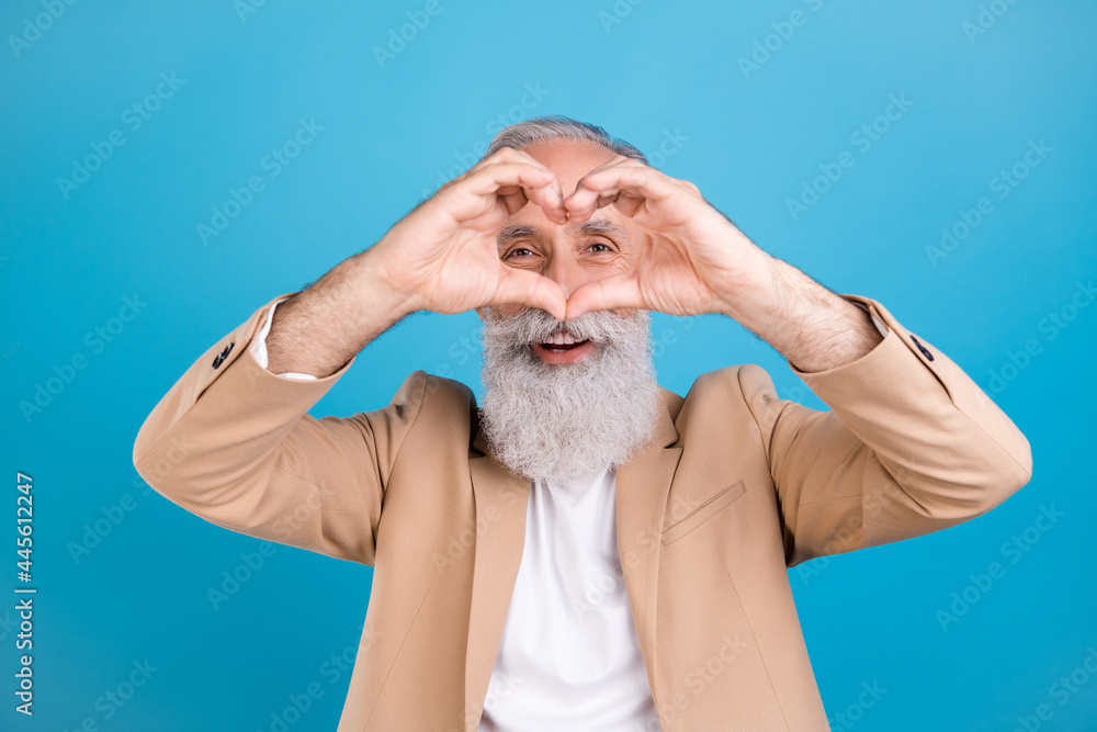 Sticker portrait of handsome classy cheerful grey-haired man showing heart symbol look isolated over bright 