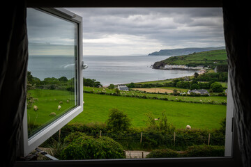 Fototapeta na wymiar Window view - fields and farms over the Northern Ireland landscape