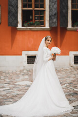 Fototapeta premium Portrait of a beautiful fashion bride, sweet and sensual. Wedding make up and hair