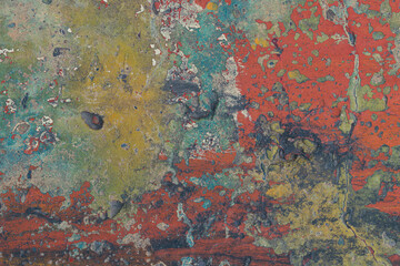 Colored textured wall surface. Old multicolor paint. Colorful background concept.