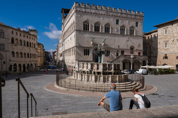 Fototapeta na wymiar Couple Of Tourists Looking At Main Square City of Perugia Umbria Italy