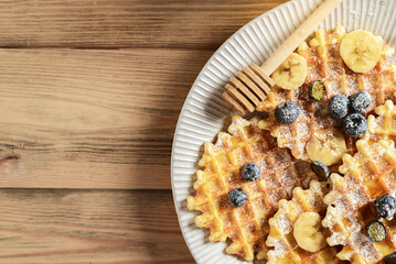 blueberry waffles on a wooden background