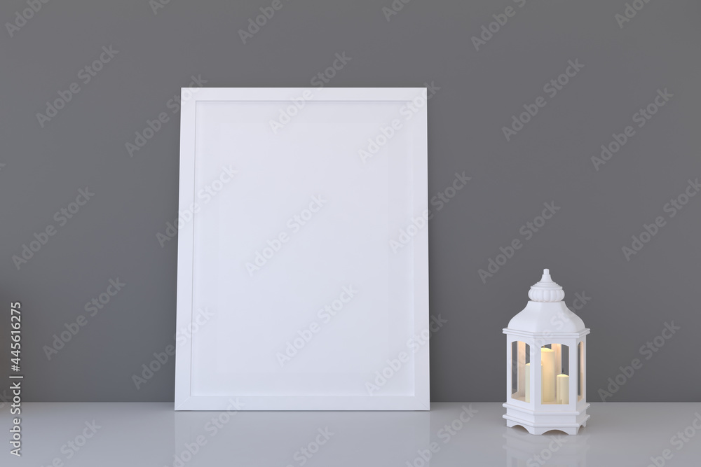 Poster frame with a blank canvas and a candlestick with lit candles