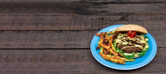 Healthy vegetarian burger with fried sweet potato serving with space for text