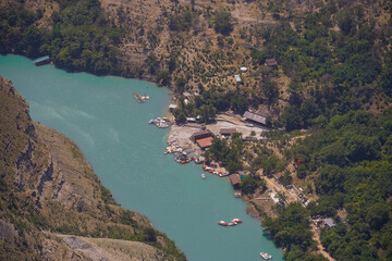 Sulak canyon, Russia, Republic of Dagestan. Observation deck in the village of Dubki. A unique natural attraction of Russia. A turquoise river framed by rocks is a beautiful landscape.