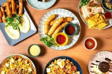 Top view of various dishes from different parts of latin america.